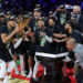 LAS VEGAS, NEVADA - DECEMBER 17: Giannis Antetokounmpo (L) #34 of the Milwaukee Bucks lifts the championship trophy as he celebrates with teammates, including Damian Lillard (C) #0, after the Bucks defeated the Oklahoma City Thunder 97-81 to win the championship game of the Emirates NBA Cup at T-Mobile Arena on December 17, 2024 in Las Vegas, Nevada. NOTE TO USER: User expressly acknowledges and agrees that, by downloading and or using this photograph, User is consenting to the terms and conditions of the Getty Images License Agreement. (Photo by Ethan Miller/Getty Images)