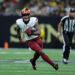 NEW ORLEANS, LOUISIANA - DECEMBER 15: Brian Robinson Jr. #8 of the Washington Commanders runs with the ball against the New Orleans Saints during a game at Caesars Superdome on December 15, 2024 in New Orleans, Louisiana. (Photo by Jonathan Bachman/Getty Images)