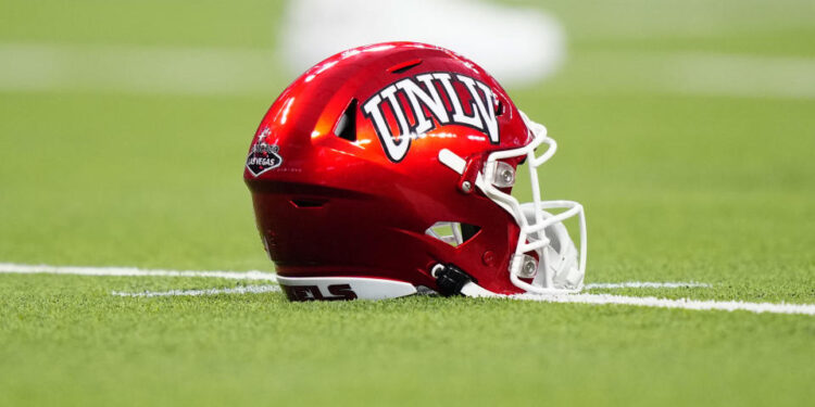 LAS VEGAS, NEVADA - SEPTEMBER 30: A UNLV Rebels helmet sits on the field during the second half of a game between the UNLV Rebels and the Hawaii Warriors at Allegiant Stadium on September 30, 2023 in Las Vegas, Nevada. Rebels defeat the Warriors 44-20. (Photo by Louis Grasse/Getty Images)