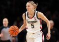 <span>Paige Bueckers of the UConn Huskies dribbles during the first half against the Louisville Cardinals at Barclays Center last Saturday.</span><span>Photograph: Sarah Stier/Getty Images</span>