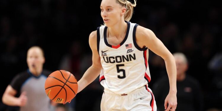 <span>Paige Bueckers of the UConn Huskies dribbles during the first half against the Louisville Cardinals at Barclays Center last Saturday.</span><span>Photograph: Sarah Stier/Getty Images</span>