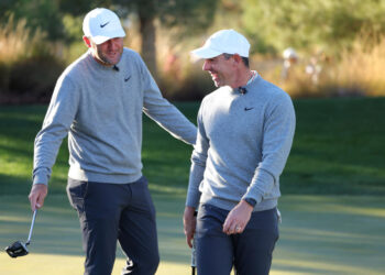 LAS VEGAS, NEVADA - DECEMBER 17: Scottie Scheffler (L) and Rory McIlroy of the PGA Tour talk during The Showdown: McIlroy and Scheffler v DeChambeau and Koepka at Shadow Creek Golf Course on December 17, 2024 in Las Vegas, Nevada.  (Photo by Kevin C. Cox/Getty Images for The Showdown)