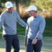 LAS VEGAS, NEVADA - DECEMBER 17: Scottie Scheffler (L) and Rory McIlroy of the PGA Tour talk during The Showdown: McIlroy and Scheffler v DeChambeau and Koepka at Shadow Creek Golf Course on December 17, 2024 in Las Vegas, Nevada.  (Photo by Kevin C. Cox/Getty Images for The Showdown)