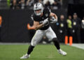 Las Vegas Raiders tight end Brock Bowers (89) carries the ball during an NFL football game against the Jacksonville Jaguars, Sunday,Dec 22, 2024, in Las Vegas. (AP Photo/David Becker)