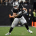 Las Vegas Raiders tight end Brock Bowers (89) carries the ball during an NFL football game against the Jacksonville Jaguars, Sunday,Dec 22, 2024, in Las Vegas. (AP Photo/David Becker)