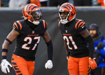 Dec 22, 2024; Cincinnati, Ohio, USA; Cincinnati Bengals safety Jordan Battle (27) reacts after a play with cornerback Mike Hilton (21) in the second half against the Cleveland Browns at Paycor Stadium. Mandatory Credit: Katie Stratman-Imagn Images