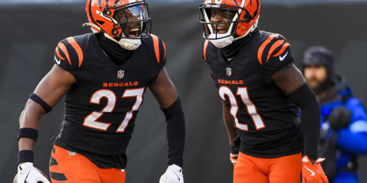 Dec 22, 2024; Cincinnati, Ohio, USA; Cincinnati Bengals safety Jordan Battle (27) reacts after a play with cornerback Mike Hilton (21) in the second half against the Cleveland Browns at Paycor Stadium. Mandatory Credit: Katie Stratman-Imagn Images