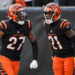 Dec 22, 2024; Cincinnati, Ohio, USA; Cincinnati Bengals safety Jordan Battle (27) reacts after a play with cornerback Mike Hilton (21) in the second half against the Cleveland Browns at Paycor Stadium. Mandatory Credit: Katie Stratman-Imagn Images