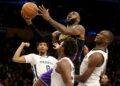 Los Angeles, CA - Lakers forward Lebron James drives to the basket against a trio of Grizzlies defenders.