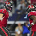 Baker Mayfield #6 of the Tampa Bay Buccaneers celebrates after scoring a touchdown against the Dallas Cowboys during an NFL football game at AT&T Stadium on December 22, 2024 in Arlington, Texas. (Photo by Cooper Neill/Getty Images)