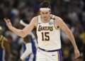 Los Angeles Lakers guard Austin Reaves (15) celebrates his three-point basket.