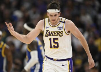 Los Angeles Lakers guard Austin Reaves (15) celebrates his three-point basket.