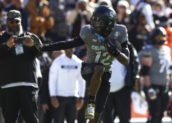 BOULDER, COLORADO - NOVEMBER 16: Travis Hunter #12 of the Colorado Buffaloes celebrates after an interception by striking the Heisman pose during the first half against the Utah Utes at Folsom Field on November 16, 2024 in Boulder, Colorado. (Photo by Aaron M. Sprecher/Getty Images)