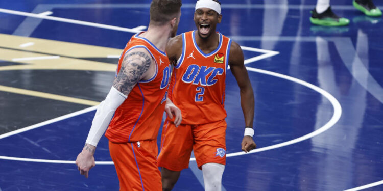 Dec 10, 2024; Oklahoma City, Oklahoma, USA; Oklahoma City Thunder guard Shai Gilgeous-Alexander (2) celebrates with center Isaiah Hartenstein (55) after he dunks against the Dallas Mavericks during the third quarter at Paycom Center. Mandatory Credit: Alonzo Adams-Imagn Images