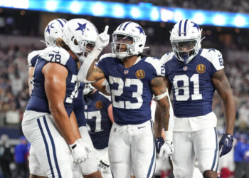 Nov 28, 2024; Arlington, Texas, USA;  Dallas Cowboys running back Rico Dowdle (23) celebrates with teammates after scoring a touchdown against the New York Giants during the second half at AT&T Stadium. Mandatory Credit: Chris Jones-Imagn Images