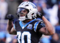 Carolina Panthers running back Chuba Hubbard celebrates after a long run against the Arizona Cardinals during overtime of an NFL football game, Sunday, Dec. 22, 2024, in Charlotte, N.C. (AP Photo/Rusty Jones)