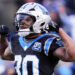 Carolina Panthers running back Chuba Hubbard celebrates after a long run against the Arizona Cardinals during overtime of an NFL football game, Sunday, Dec. 22, 2024, in Charlotte, N.C. (AP Photo/Rusty Jones)