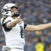 Navy quarterback Blake Horvath (11) celebrates after scoring a touchdown during the first half of an NCAA college football game against Army, Saturday, Dec. 14, 2024, in Landover, Md. (AP Photo/Daniel Kucin Jr.)