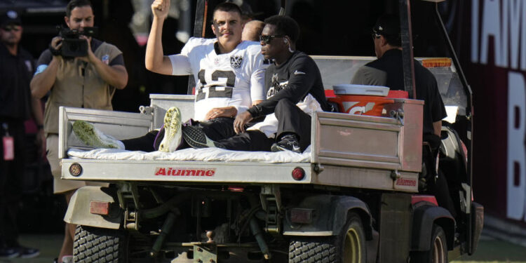 Las Vegas Raiders quarterback Aidan O'Connell left Sunday's game with air cast on his left leg. (AP Photo/Chris O'Meara)