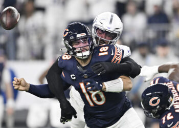 Jonathan Greenard of the Minnesota Vikings strips sacks Caleb Williams of the Chicago Bears during the Vikings' win on Monday night. (Photo by Stephen Maturen/Getty Images)