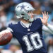 CHARLOTTE, NORTH CAROLINA - DECEMBER 15: Cooper Rush #10 of the Dallas Cowboys attempts a pass during the second half of the game against the Carolina Panthers at Bank of America Stadium on December 15, 2024 in Charlotte, North Carolina. (Photo by Jared C. Tilton/Getty Images)