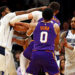 Dec 27, 2024; Phoenix, Arizona, USA; Dallas Mavericks forward Naji Marshall (13) punches Phoenix Suns center Jusuf Nurkic (20) during the third quarter at Footprint Center. Mandatory Credit: Mark J. Rebilas-Imagn Images