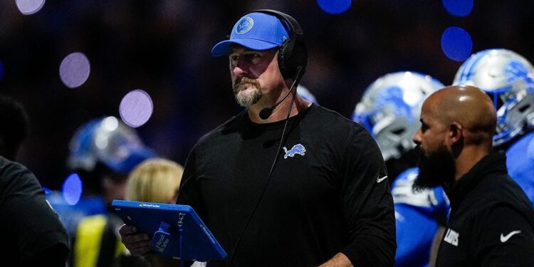 Dan Campbell looks on during a game