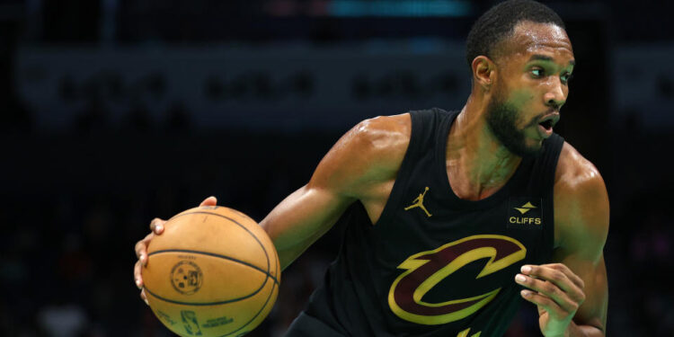 CHARLOTTE, NORTH CAROLINA - MARCH 27: Evan Mobley #4 of the Cleveland Cavaliers dribbles during the second half of the game against the Charlotte Hornets at Spectrum Center on March 27, 2024 in Charlotte, North Carolina. NOTE TO USER: User expressly acknowledges and agrees that, by downloading and or using this photograph, User is consenting to the terms and conditions of the Getty Images License Agreement. (Photo by Jared C. Tilton/Getty Images)