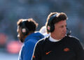 BOULDER, COLORADO - NOVEMBER 29: Head coach Mike Gundy of the Oklahoma State Cowboys looks on during the first quarter against the Colorado Buffaloes at Folsom Field on November 29, 2024 in Boulder, Colorado. (Photo by Andrew Wevers/Getty Images)