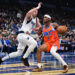 OKLAHOMA CITY, OKLAHOMA - DECEMBER 10: Shai Gilgeous-Alexander #2 of the Oklahoma City Thunder handles the ball in front of Luka Doncic #77 of the Dallas Mavericks during the first half at Paycom Center on December 10, 2024 in Oklahoma City, Oklahoma. NOTE TO USER: User expressly acknowledges and agrees that, by downloading and or using this photograph, User is consenting to the terms and conditions of the Getty Images License Agreement. (Photo by Joshua Gateley/Getty Images)