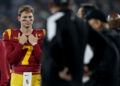 PASADENA, CALIFORNIA - NOVEMBER 23: Miller Moss #7 of the USC Trojans looks on from the sideline during the second half of a game against the UCLA Bruins at the Rose Bowl on November 23, 2024 in Pasadena, California.  (Photo by Sean M. Haffey/Getty Images)