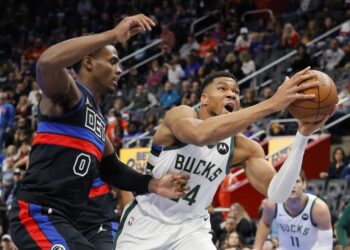 Milwaukee Bucks forward Giannis Antetokounmpo (34) goes to the basket past Detroit Pistons center Jalen Duren (0) during the first half of an Emirates NBA Cup basketball game Tuesday, Dec. 3, 2024, in Detroit. (AP Photo/Duane Burleson)