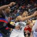 Milwaukee Bucks forward Giannis Antetokounmpo (34) goes to the basket past Detroit Pistons center Jalen Duren (0) during the first half of an Emirates NBA Cup basketball game Tuesday, Dec. 3, 2024, in Detroit. (AP Photo/Duane Burleson)