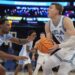 North Carolina's Ty Claude, left, defends UCLA's Tyler Bilodeau, right, during the first half.