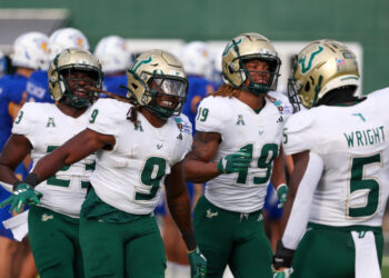 HONOLULU, HAWAII - DECEMBER 24: Ta'Ron Keith #9 of the South Florida Bulls celebrates with Nay'Quan Wright #5 after scoring a touchdown during the first half of the game against the San Jose Spartans at the Clarence T.C. Ching Athletics Complex on December 24, 2024 in Honolulu, Hawaii. (Photo by Darryl Oumi/Getty Image