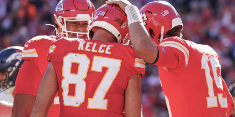 Nov 10, 2024; Kansas City, Missouri, USA; Kansas City Chiefs tight end Travis Kelce (87) celebrates with quarterback Patrick Mahomes (15) after scoring against the Denver Broncos during the game at GEHA Field at Arrowhead Stadium. Mandatory Credit: Denny Medley-Imagn Images