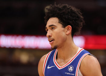 CHICAGO, ILLINOIS - DECEMBER 08: Jared McCain #20 of the Philadelphia 76ers looks on against the Chicago Bulls during the second half at the United Center on December 08, 2024 in Chicago, Illinois. NOTE TO USER: User expressly acknowledges and agrees that, by downloading and or using this photograph, User is consenting to the terms and conditions of the Getty Images License Agreement.  (Photo by Michael Reaves/Getty Images)