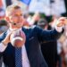 Analyst Kirk Herbstreit tosses the football with fans on the set of ESPN's College Game Day at the University of Texas ahead of the Longhorns' game against the Georgia Bulldogs in Austin, Texas, on Oct. 19, 2024.