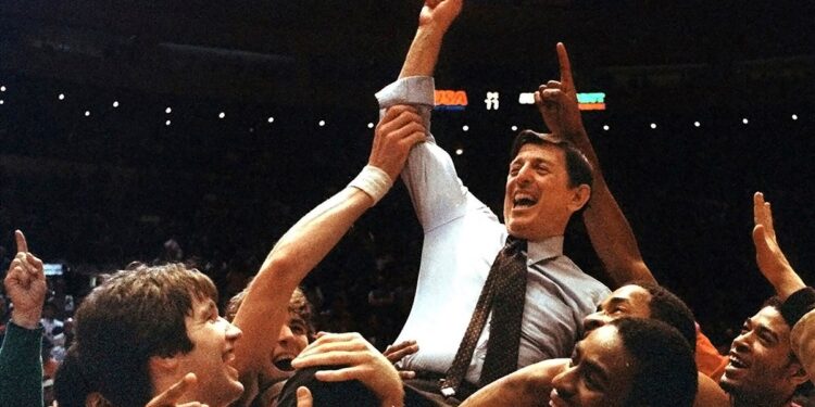 Lou Carnesecca carried by his team