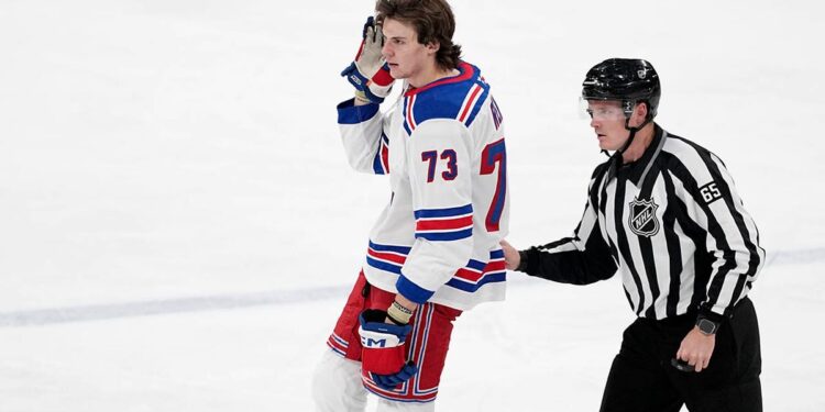 Matt Rempe escorted off the ice