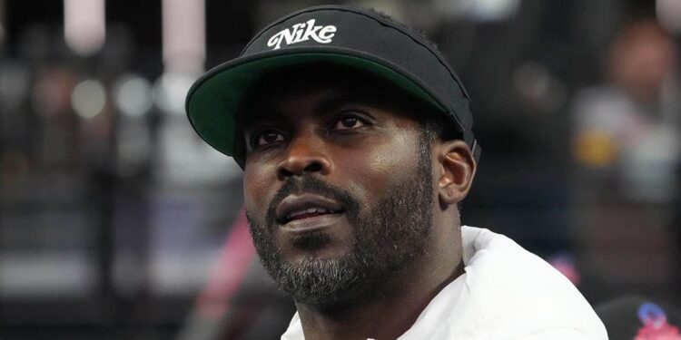 Michael Vick looks on field