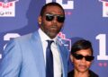 Randy Moss poses with wife