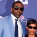 Randy Moss poses with wife