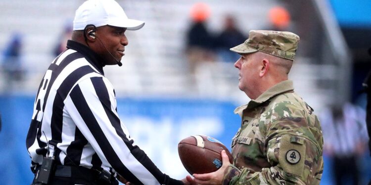 Rory Bernard shakes hand with Tennessee National Guard