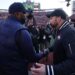 Sherrone Moore shakes hands with Ryan Day