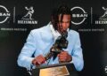 Travis Hunter kisses Heisman Trophy