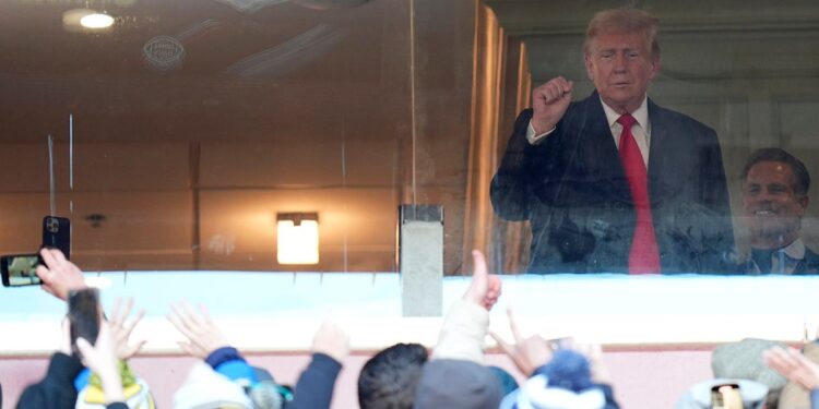 Trump saluting fans