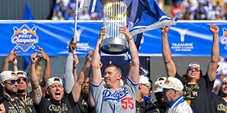 Walker Buehler raises World Series trophy