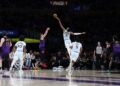 San Antonio Spurs center Victor Wembanyama (1) blocks a 3-point basket-attempt by Los Angeles Lakers guard Dalton Knecht, third from front left, during the first quarter of an NBA basketball game Monday, Jan. 13, 2025, in Los Angeles. (AP Photo/Kevork Djansezian)