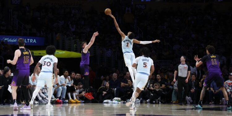 San Antonio Spurs center Victor Wembanyama (1) blocks a 3-point basket-attempt by Los Angeles Lakers guard Dalton Knecht, third from front left, during the first quarter of an NBA basketball game Monday, Jan. 13, 2025, in Los Angeles. (AP Photo/Kevork Djansezian)